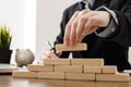 front view businessman with wooden building blocks. High quality beautiful photo concept Royalty Free Stock Photo