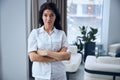 Serene woman doctor standing in her office Royalty Free Stock Photo