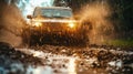 Front view of car is driving at a fast speed through the puddles and mud