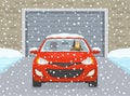 Front view of a car with leaving the garage. Young man driving a red mini car in winter conditions. Royalty Free Stock Photo