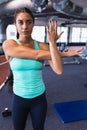 Female athletic exercising in fitness center