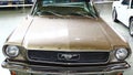 Front view of classic american pony car Ford Mustang, first generation from year 1964, beige metallic colour Royalty Free Stock Photo