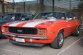 classic american sports car, first generation Chevrolet Camaro 350 Rally Sport in red orange color Royalty Free Stock Photo