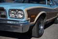 Front view of classic long station wagon with wood-veneered doors, it's a blue Ford Gran Torino. Royalty Free Stock Photo