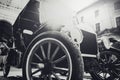 Front view of antique classic vintage car. Retro toned black and white postcard, poster Royalty Free Stock Photo