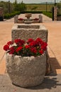 Front view, close up of an artisan stone planter in front of Winery