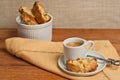 Front view, close up of homemade, freshly baked, apricot walnut biscotti and cup of espresso Royalty Free Stock Photo