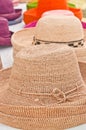 Variety of weaved, straw hats on display and for sale