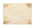 Old vintage aged empty paper postcard texture with faded stamp print and brown stains isolated on white Royalty Free Stock Photo