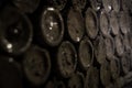 Aged wine bottles covered with mold in vintage wine cellar Royalty Free Stock Photo