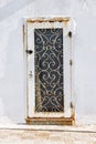front view closeup of vintage metal door with wood texture and metallic handle. Royalty Free Stock Photo