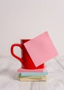 Front view coffee cup mug hot drinks blank colored sticky note stacked note pads lying retro vintage rustic old table Royalty Free Stock Photo