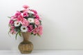 front view colorful flowers on brown vase on white wall background,copy space