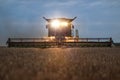 Front view of a combine harvester in the evening