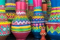 Stack of artistic painted colorful handcrafted pottery vases Royalty Free Stock Photo