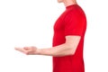 Front view of confident male in blank red t-shirt hold something isolated white