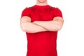 Front view of confident male in blank red t-shirt posing with crossed arms