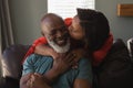 Senior couple having fun in living room Royalty Free Stock Photo