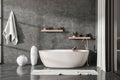 Front view on dark bathroom interior with bathtub, glass partition