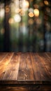 A front view of a dark brown. empty wooden table with a blurry background. Royalty Free Stock Photo