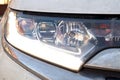 Front view detail of a car headlight, White Royalty Free Stock Photo