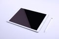 Front view diagonal of white tablet computer with blank screen