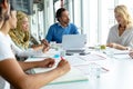 Business people discussing with each other in meeting at conference room in a modern office Royalty Free Stock Photo