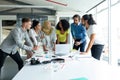 Business people interacting with each other at conference room in a modern office Royalty Free Stock Photo