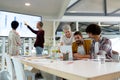 Business people using laptop and discussing over graph in the conference room Royalty Free Stock Photo