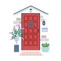 Front view of door outside of house. Closed locked home entrance exterior, facade with potted flower plants, lamp, mail