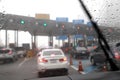 Front view of Driving with car windshield wipers in raining day on the expressway tollgate