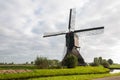 Front view Dutch windmill in autumn