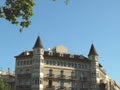 Front view of elegant castle like building from outside in streets of Barcelona