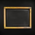 Front view of empty black chalkboard with wooden frame, copy space Royalty Free Stock Photo