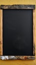 Front view of empty black chalkboard with wooden frame, copy space Royalty Free Stock Photo