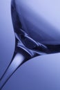 Front view of empty wine glass, on blue background Royalty Free Stock Photo