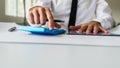 Front view of engineer sitting at his office desk with a project Royalty Free Stock Photo