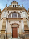 Front view of entrance of an old European style building with interesting historical facade ornaments and decorations Royalty Free Stock Photo