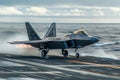 Front view of an F-22 Raptor fighter jet accelerating during takeoff on an aircraft carrier runway. The aircraft is sent