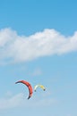 Orange canopy, filled with wind power, to propel a kite board