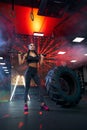 Female bodybuilder posing in gym. Royalty Free Stock Photo