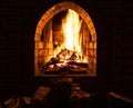 Fireplace with burning firewood at night Royalty Free Stock Photo