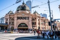 Front view of Flinders street railway station building entrance full of pleople in Melbourne Australia