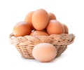 Front view of fresh brown chicken eggs in stack in wicker basket isolated on white background with clipping path Royalty Free Stock Photo