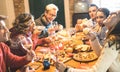 Friends group eating christmas sweets food and having fun at xmas dinner party Royalty Free Stock Photo