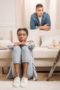 front view of frustraited african american couple beside couch Royalty Free Stock Photo