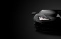 Front view of a generic and brandless modern sport car on a black background Royalty Free Stock Photo