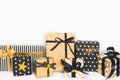 Front view of gift boxes in various black, white and golden designs. Copy space. A concept of Christmas, New Year, birthday celebr