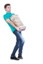 Front view of going handsome man carries a stack of books.