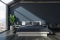 Front view of gray attic bedroom Royalty Free Stock Photo